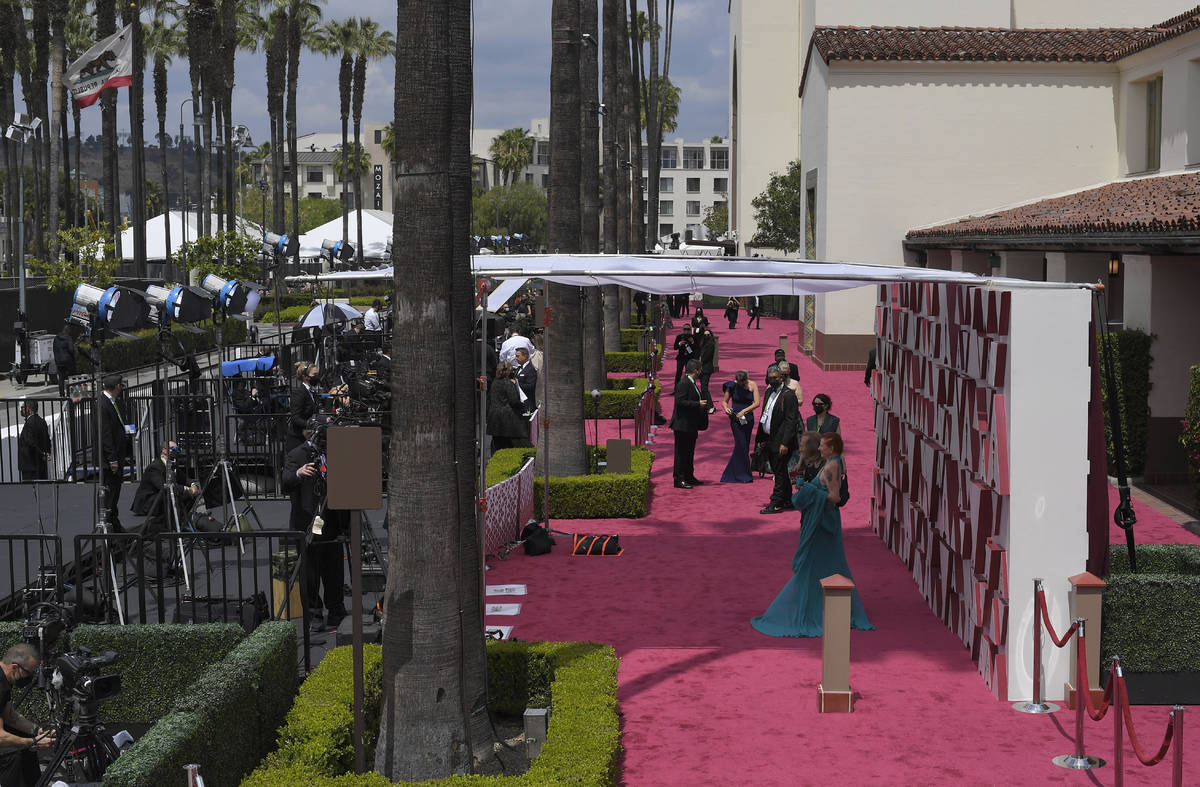 Paul Raci, left, and Liz Hanley Raci arrive at the Oscars on Sunday, April 25, 2021, at Union S ...