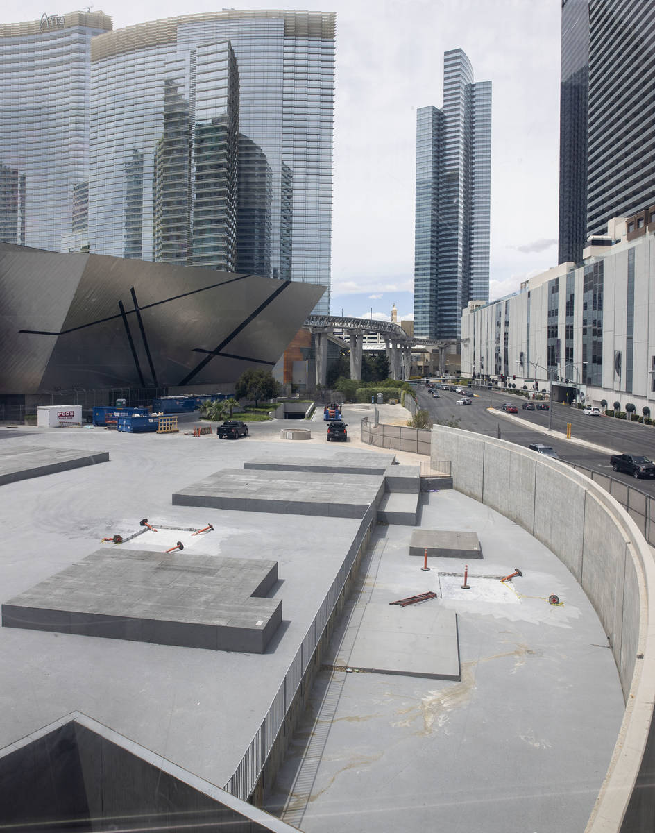 The Aria hotel-casino, left, located within the CityCenter campus, is seen on the Las Vegas Str ...