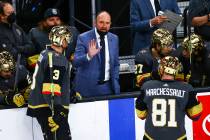 Golden Knights head coach Pete DeBoer talks with his team during the third period of an NHL hoc ...