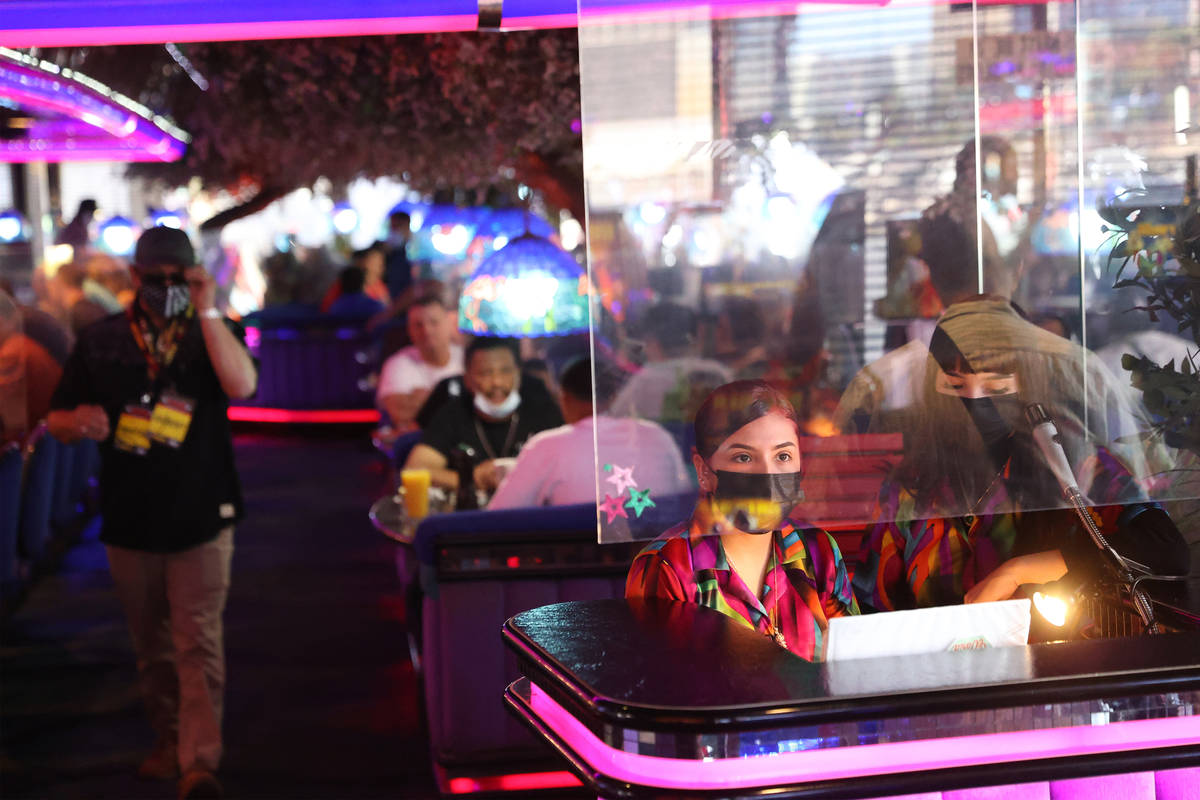Hostesses Cristina Montiel, left, and Esmeralda Valencia, work the front desk at the Peppermill ...
