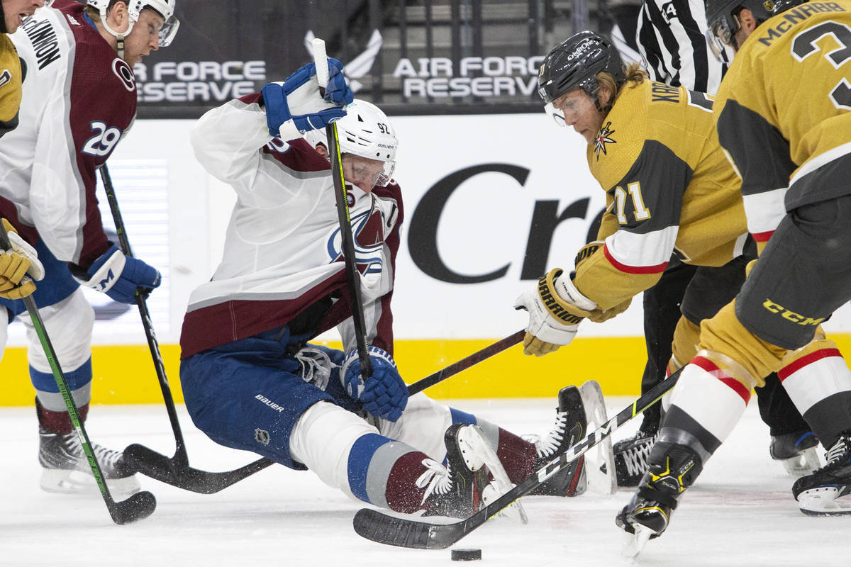 Avalanche left wing Gabriel Landeskog (92) falls to the ice after facing off against Golden Kni ...