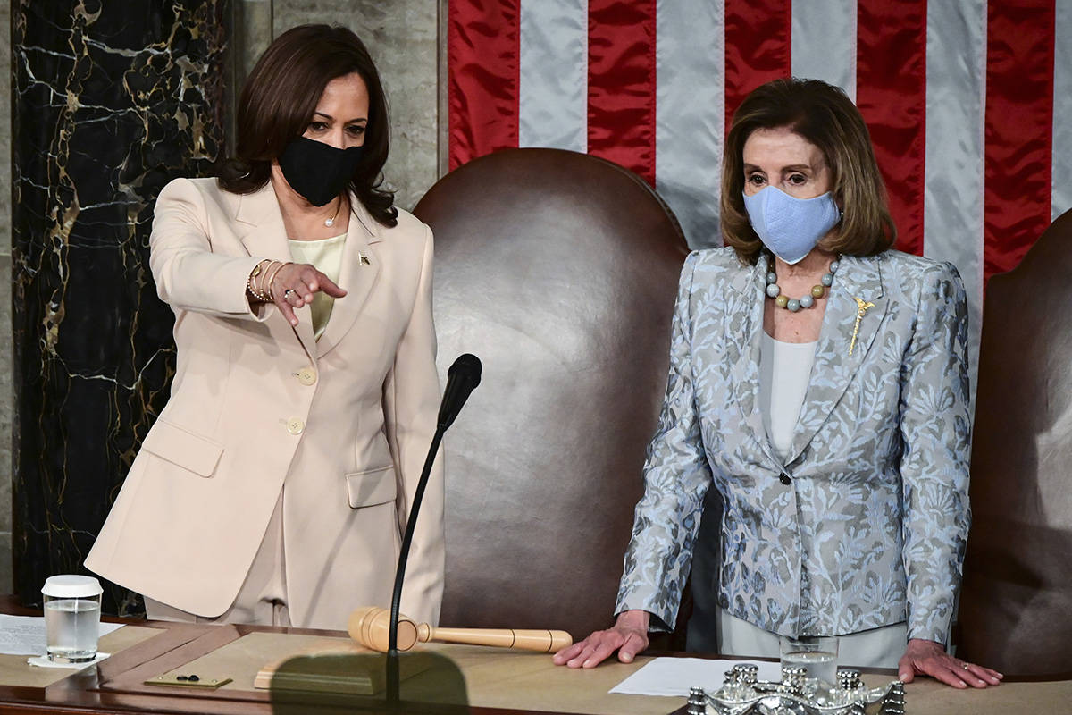 Vice President Kamala Harris, left, speaks with House Speaker Nancy Pelosi of Calif., ahead of ...