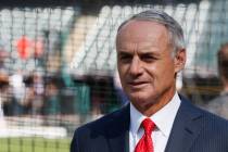 Commissioner Rob Manfred watches as the American League players warm-up for the MLB baseball Al ...