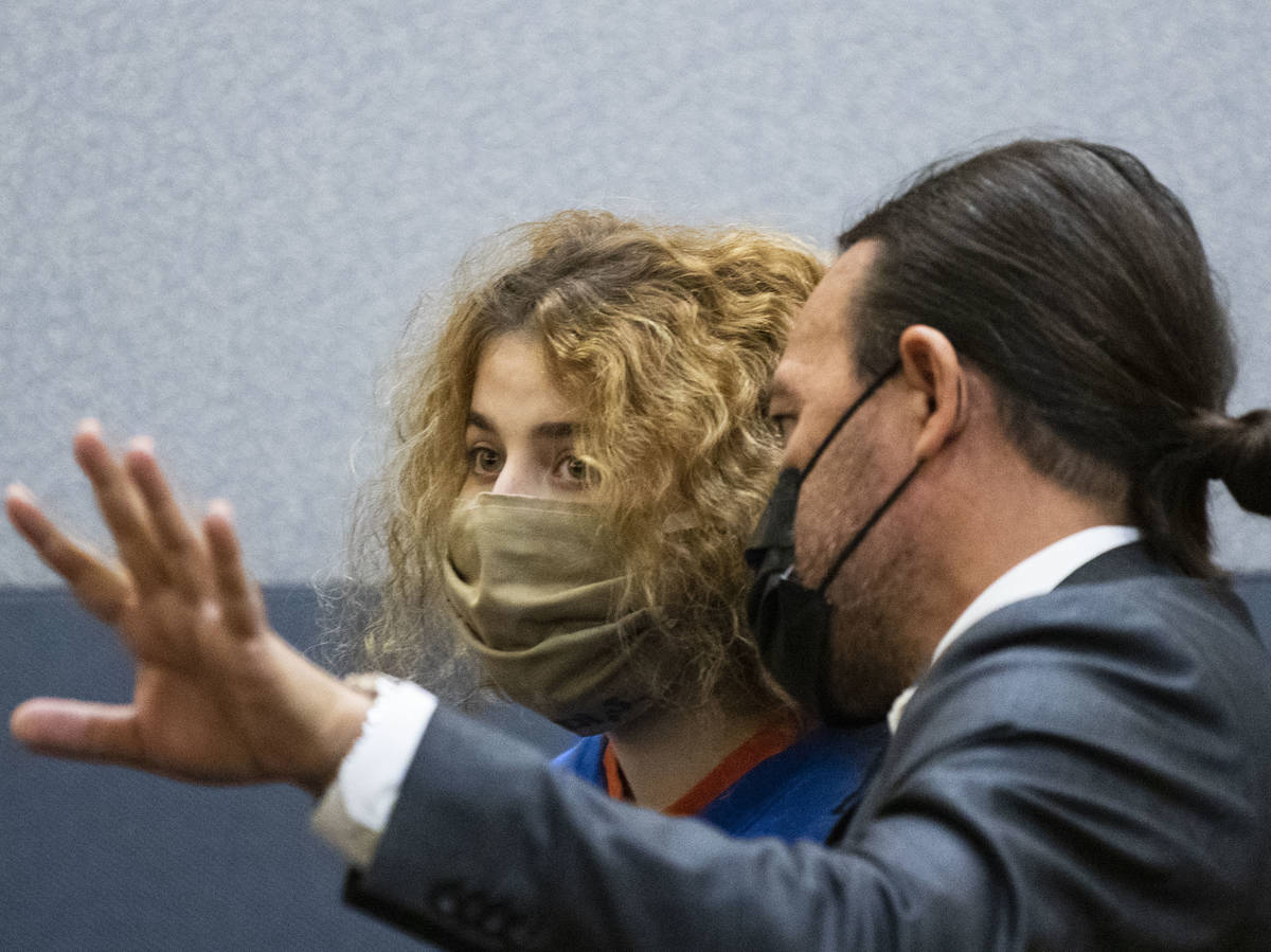 Sierra Halseth, charged in the killing of her father, Daniel Halseth, listens to her attorney M ...