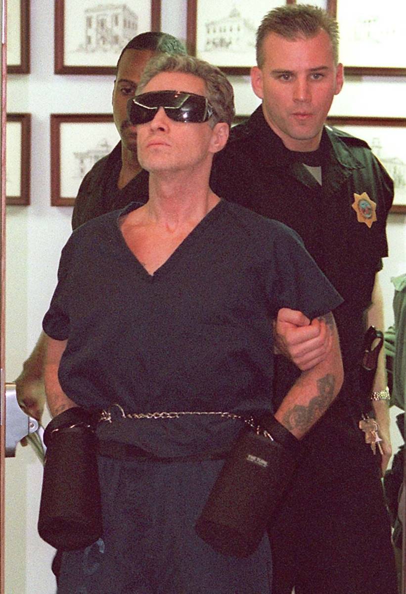 Patrick McKenna is brought into a courtroom by Metropolitan Police Department SWAT officers in ...