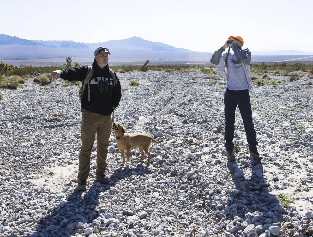 Christian Daniels, 15, uses his binoculars to spot stray balloons on Saturday, April 17, 2021, ...