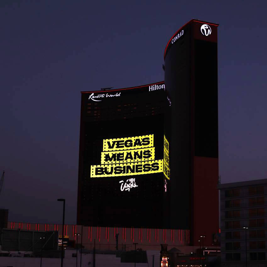 At night, the "Vegas Means Business" message stands out on Resorts World Las Vegas' massive dig ...