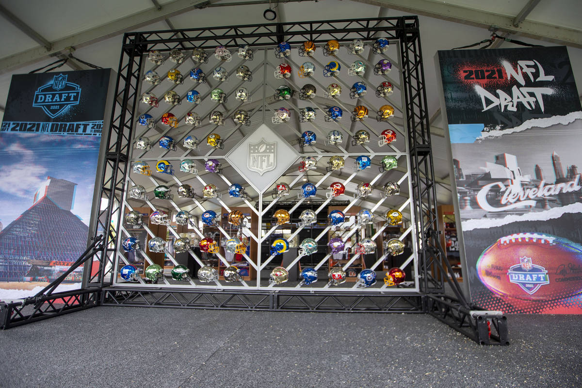 A wall of all 32 NFL teamsÕ helmets is on display in a locker room at the NFL Draft Experi ...