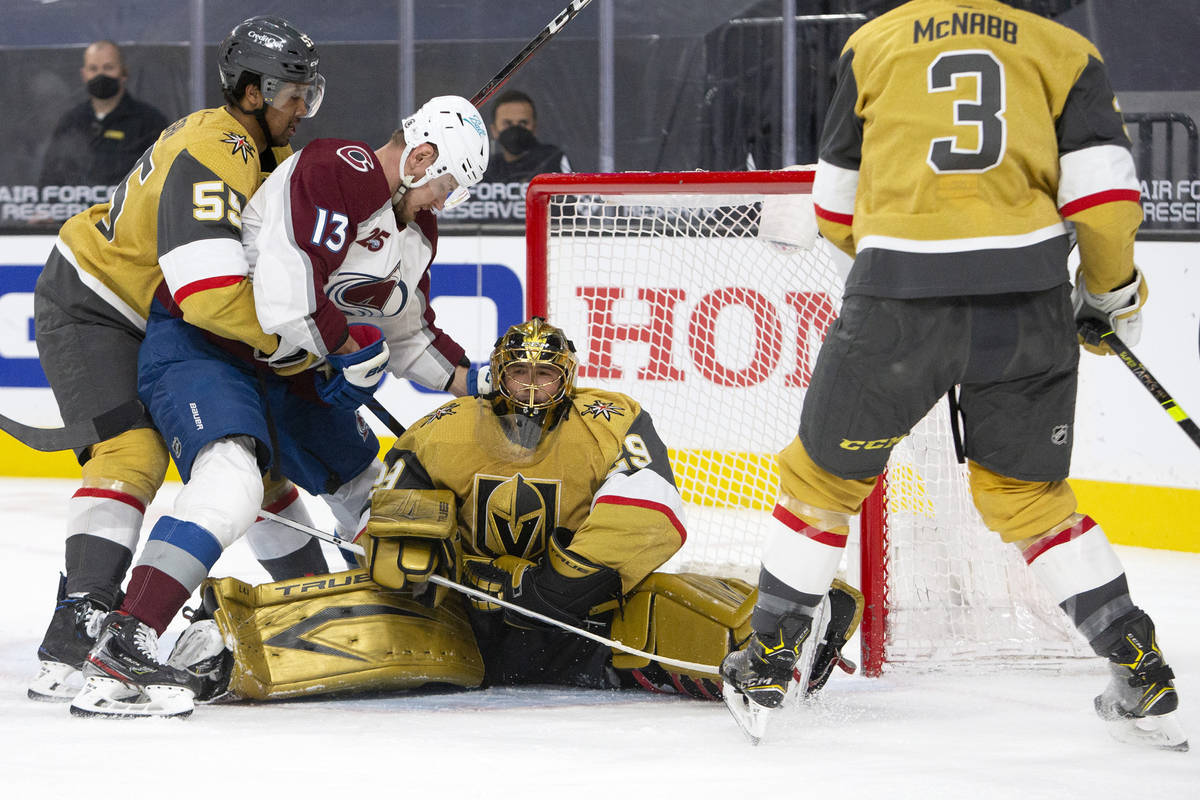 Golden Knights goaltender Marc-Andre Fleury (29) saves a shot on goal as Golden Knights right w ...