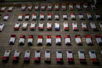 Beds lie inside an indoor stadium converted into COVID-19 treatment center for emergencies in t ...