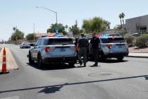 The Nevada Highway Patrol investigates at the crash scene at U.S. Highway 95 and Jones Boulevar ...