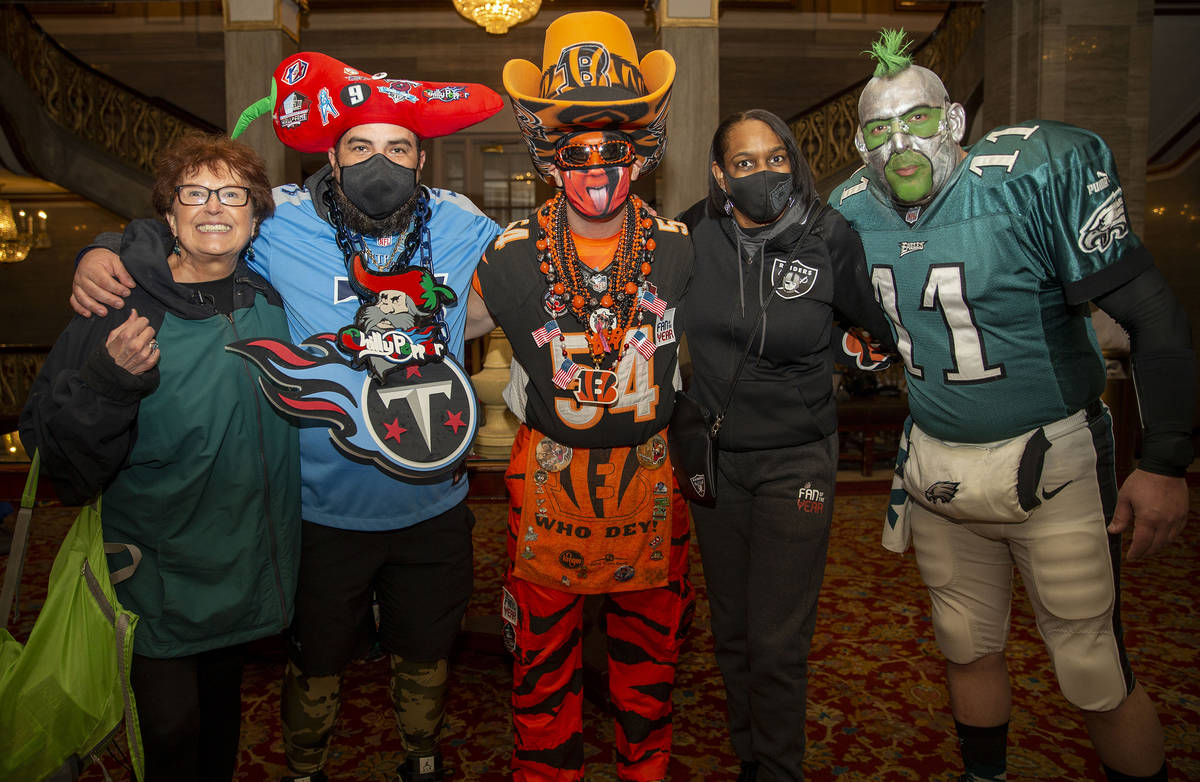 Denean Vaughn, who was selected as the Raiders Fan of the Year, meets with fans, from left, Mar ...
