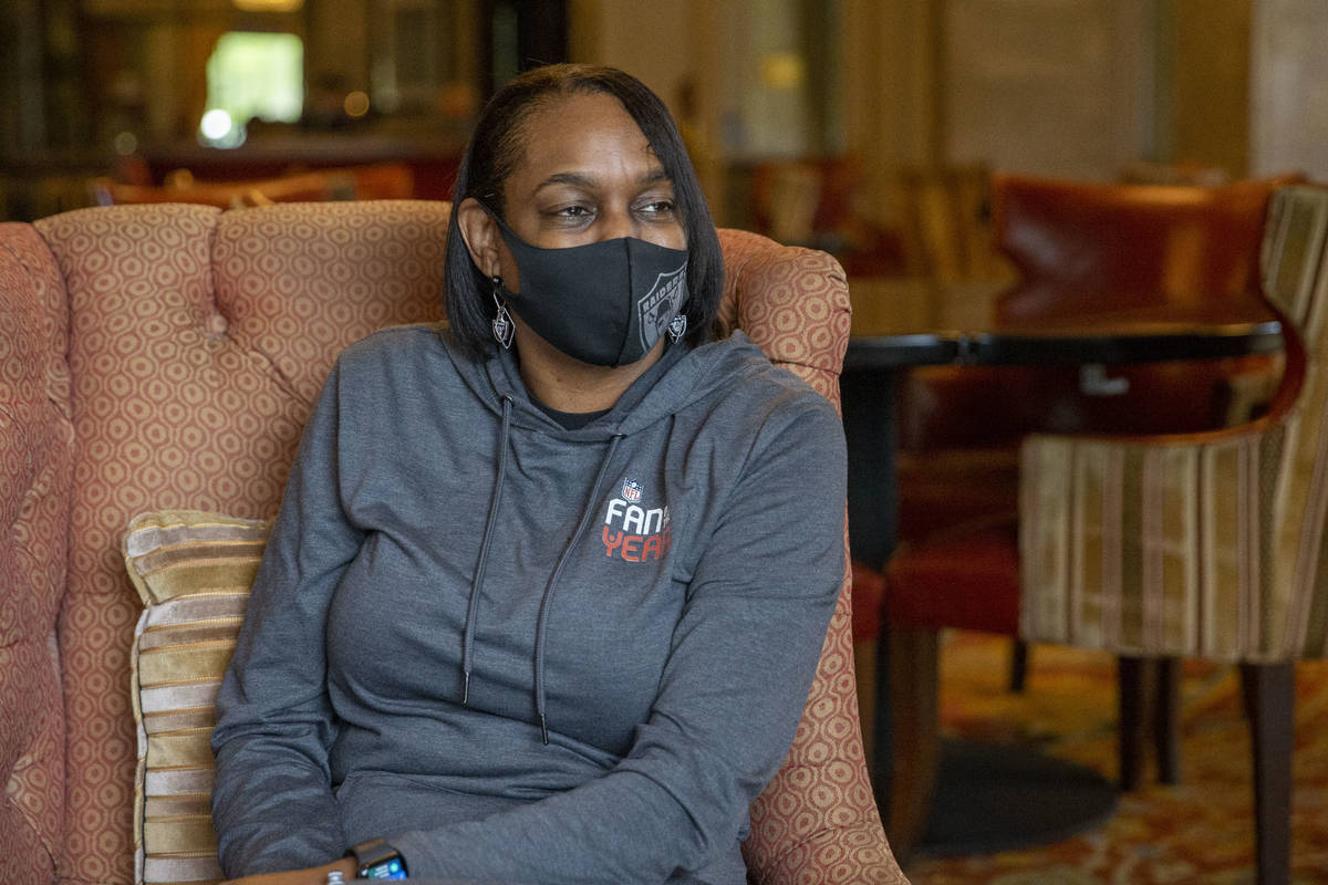 Denean Vaughn, who was selected as the Raiders Fan of the Year, is interviewed at the Renaissan ...