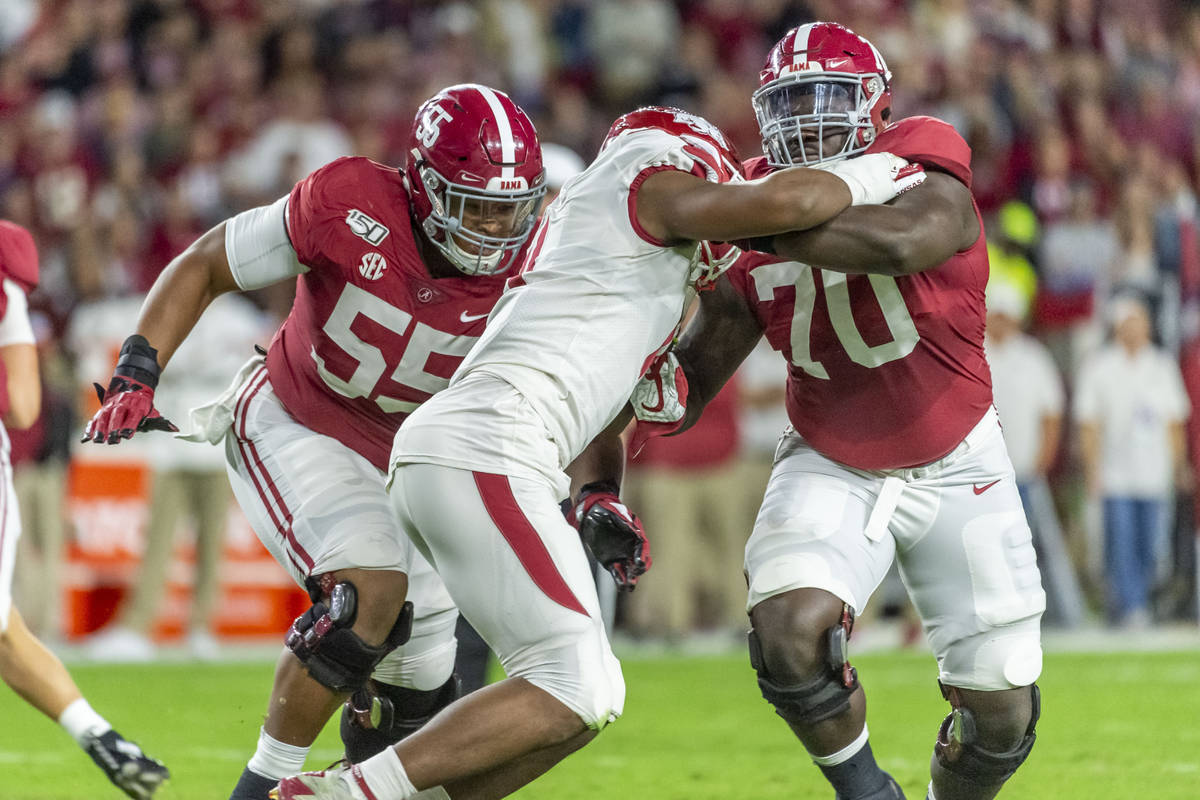 Alabama offensive lineman Alex Leatherwood (70) blocks Arkansas defensive lineman Mataio Soli ( ...