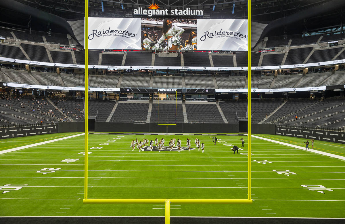 The Raiderettes leave the field before fans spread throughout the stands during the 2021 Las Ve ...