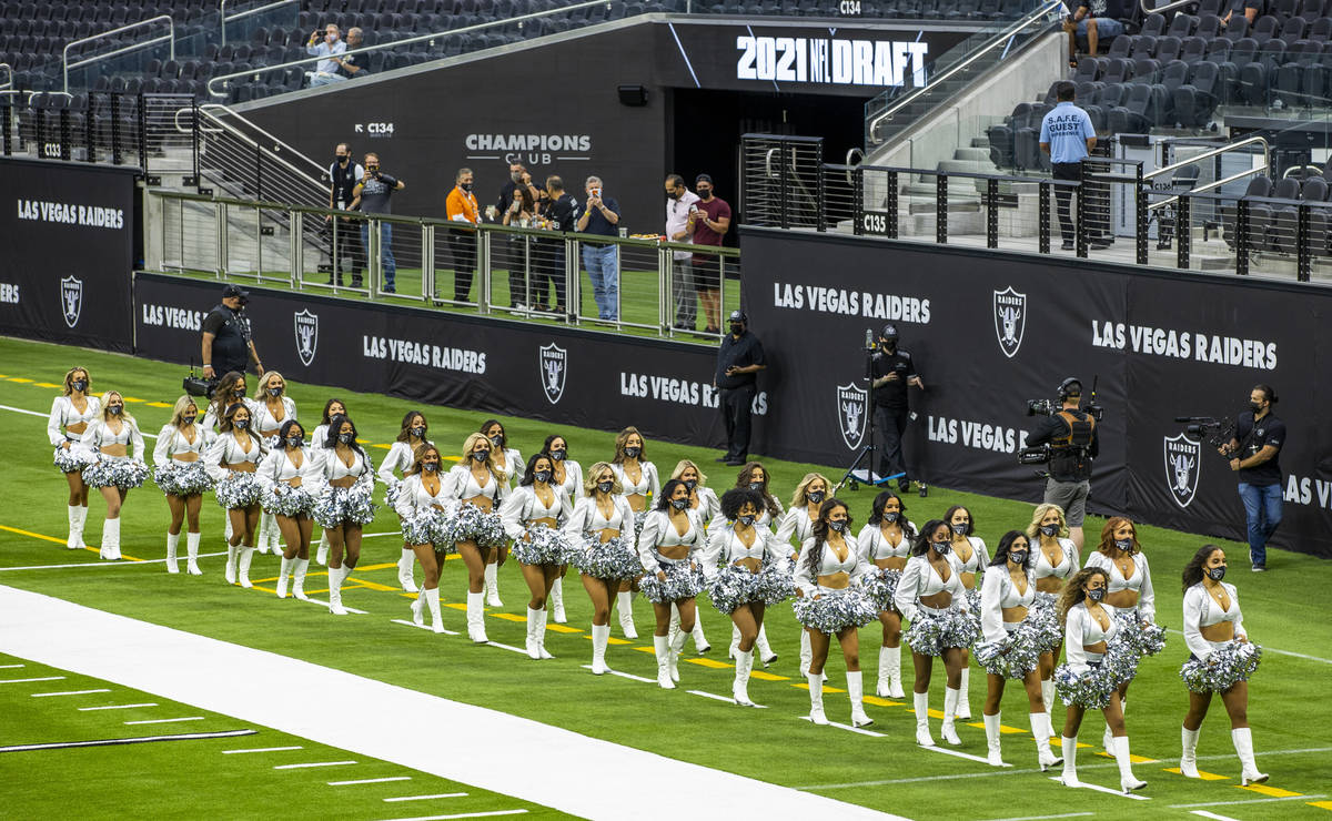 The Raiderettes leave the field before fans spread throughout the stands during the 2021 Las Ve ...