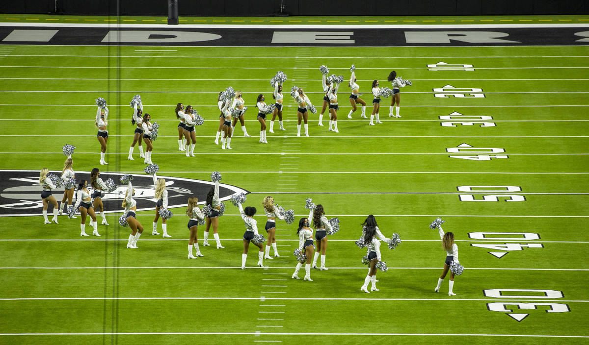 The Raiderettes perform on the field before fans spread throughout the stands as the team makes ...