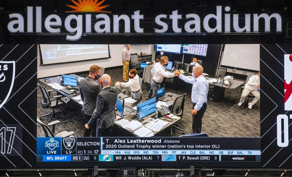 The draft room is all celebratory as Alex Leatherwood of Alabama is announced as the teamÕ ...