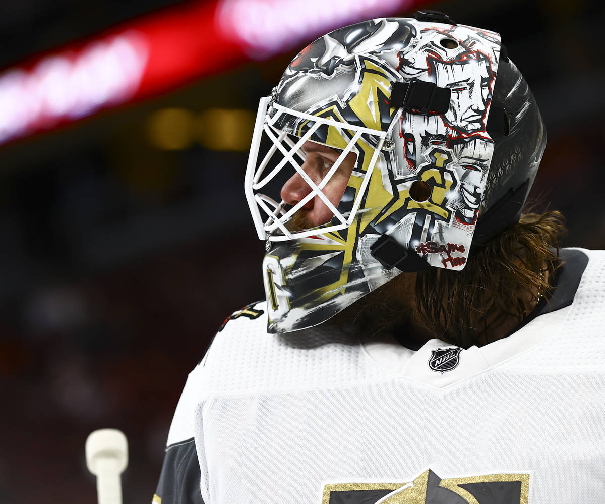 Golden Knights goaltender Robin Lehner (90) looks on during a break the second period of an NHL ...