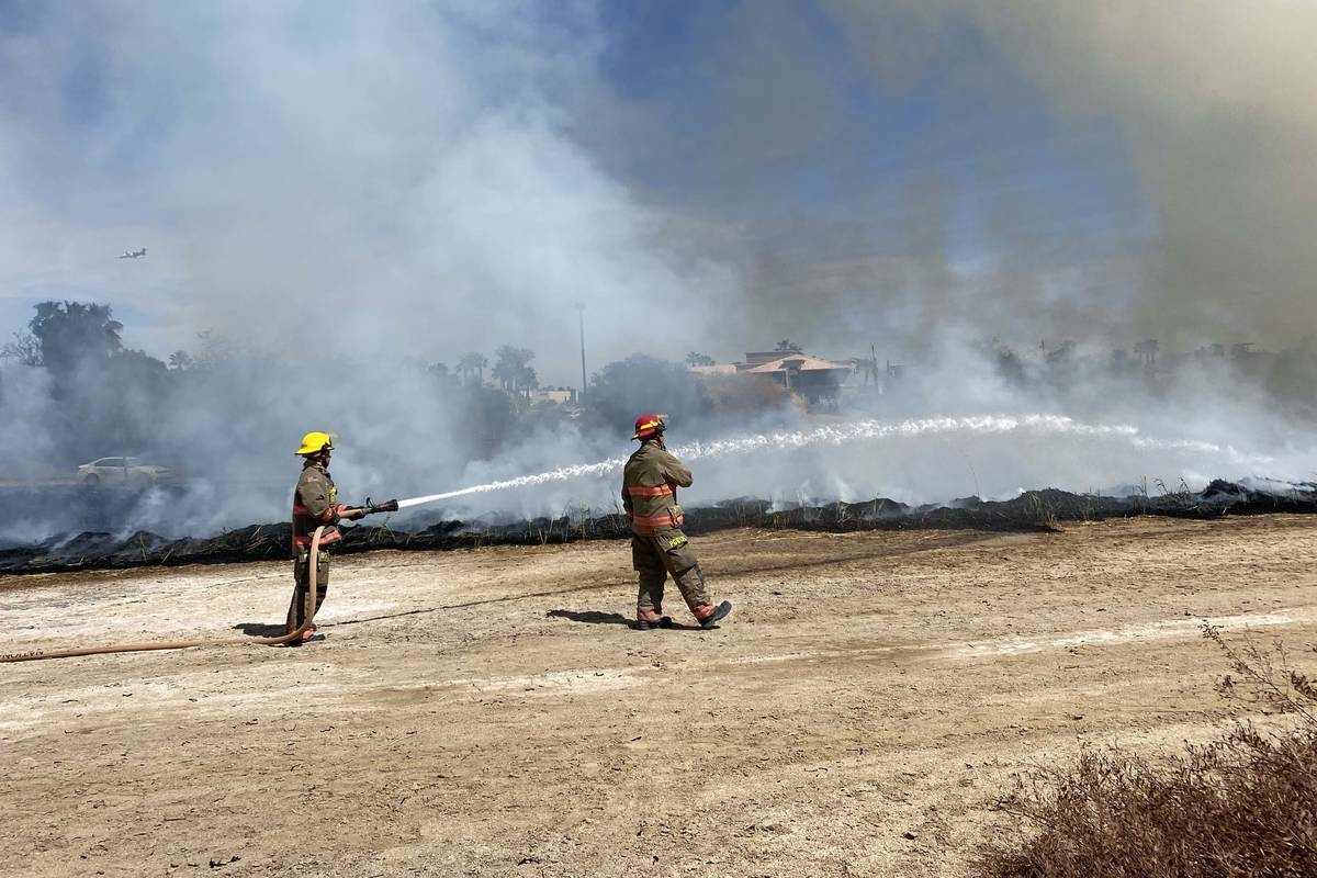 Clark County firefighters were responding to a large brush fire at Sunset Park along Sunset Roa ...