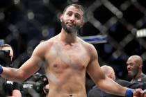 Dominick Reyes reacts as he walks away after his opponent Jon Jones, right, was named the winne ...