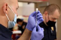 Las Vegas Fire Department paramedic Zach Allen, left, and Tyler Terrell, a paramedic with Medic ...