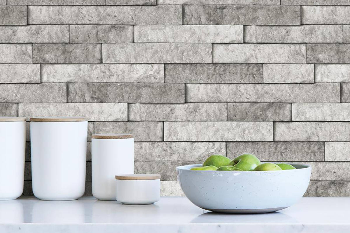 Split gray peel-and-stick natural stone tile gives an elegant look to any space. (Lowes)