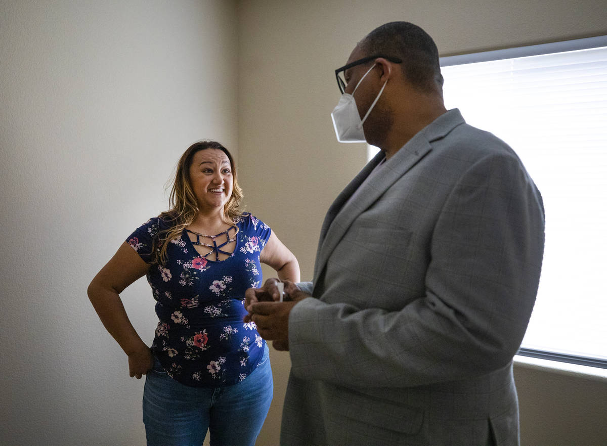 First-time homebuyer Amy Phinsee, left, listens to realtor Cassidy Cotten, right, at a showing ...