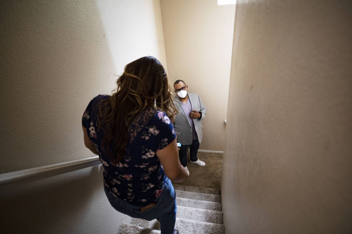 First-time homebuyer Amy Phinsee, left, listens to realtor Cassidy Cotten, right, at a showing ...