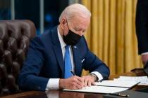 President Joe Biden signs an executive order. (AP Photo/Evan Vucci, File)