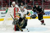 Vegas Golden Knights goaltender Robin Lehner (90) makes a save on a shot as Golden Knights defe ...