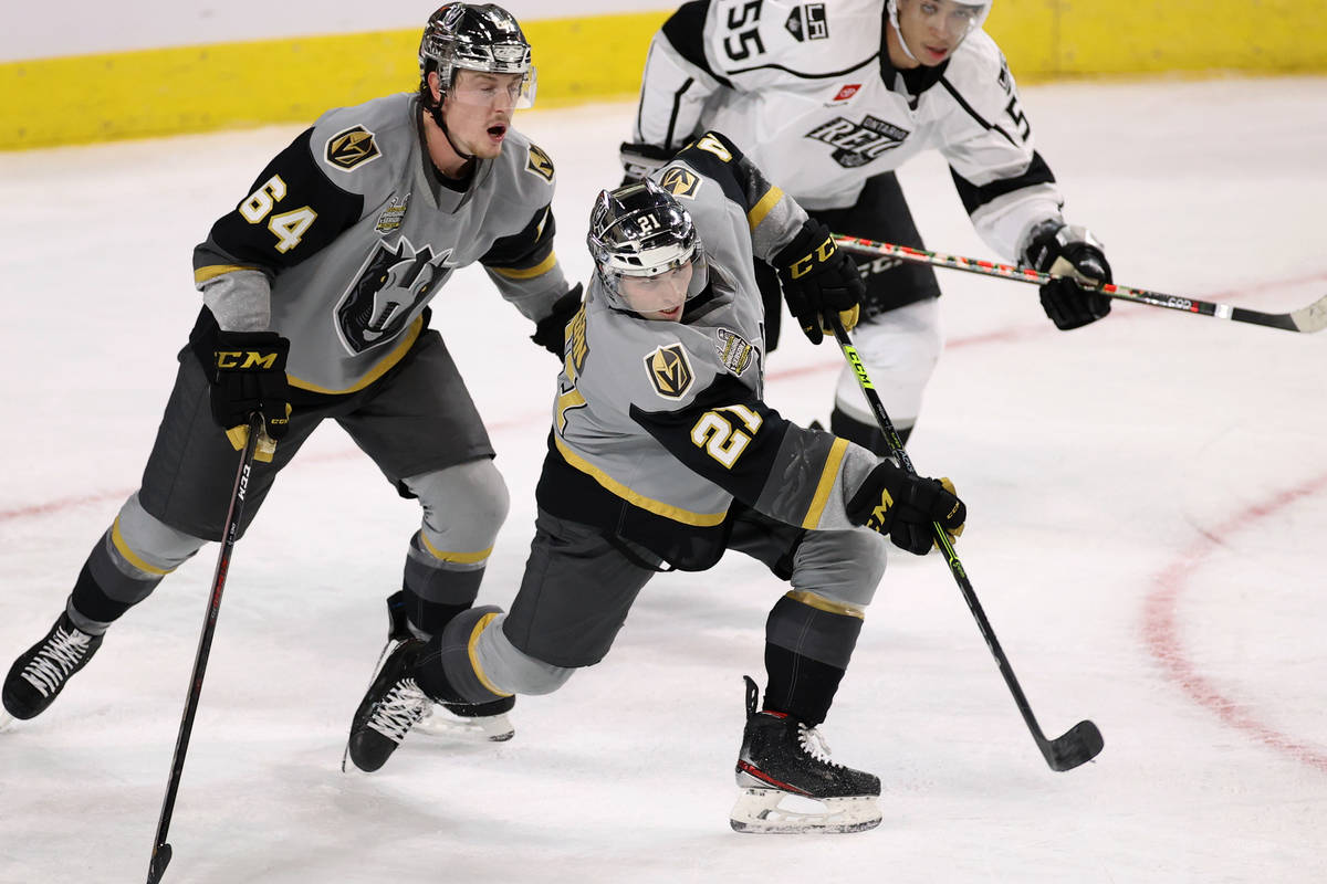 Henderson Silver Knights forward Danny O'Regan (21) shoots for an empty net goal as teammate Be ...