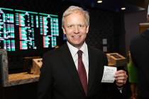 Owner of The Pass Casino Joe DeSimone places first bet during the grand opening of Derek Steven ...