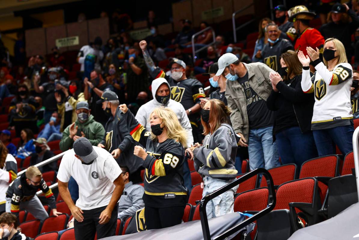 Golden Knights fans celebrate after a goal by William Karlsson, not pictured, during the first ...