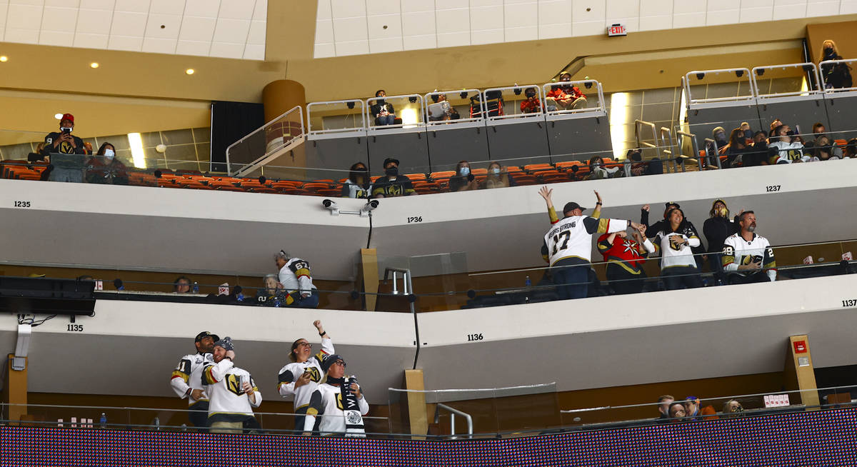 Golden Knights fans celebrate after a goal by William Karlsson, not pictured, during the first ...