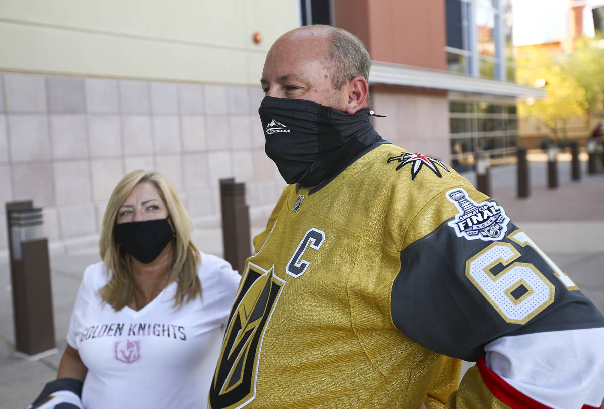 Golden Knights fans Donna Raucci, left, and Vinny Raucci talk about traveling for a road game b ...