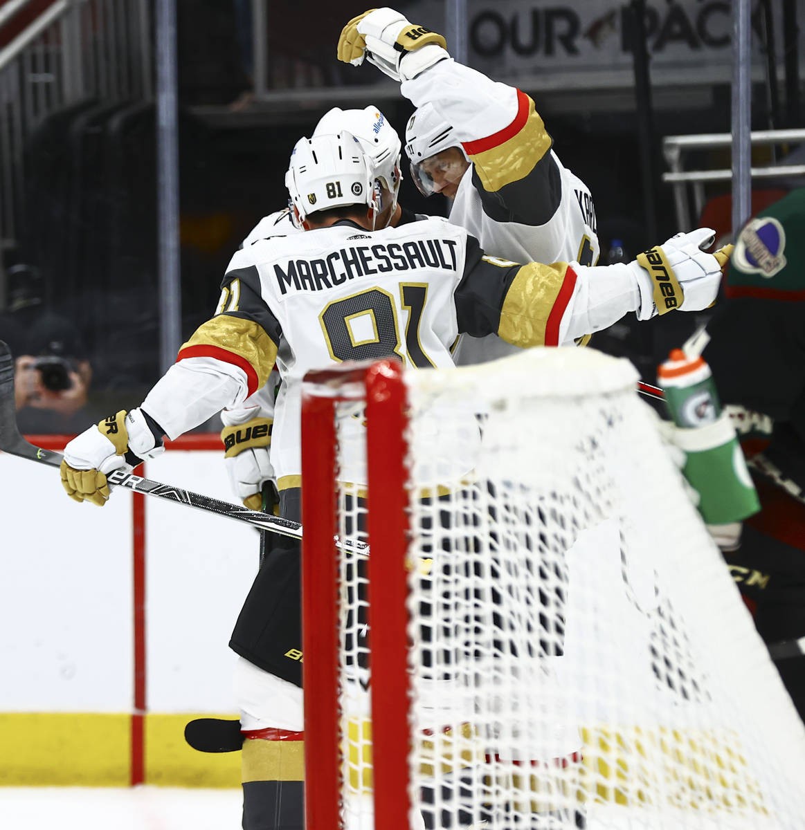 Golden Knights' William Karlsson, right, celebrates his goal against the Arizona Coyotes during ...