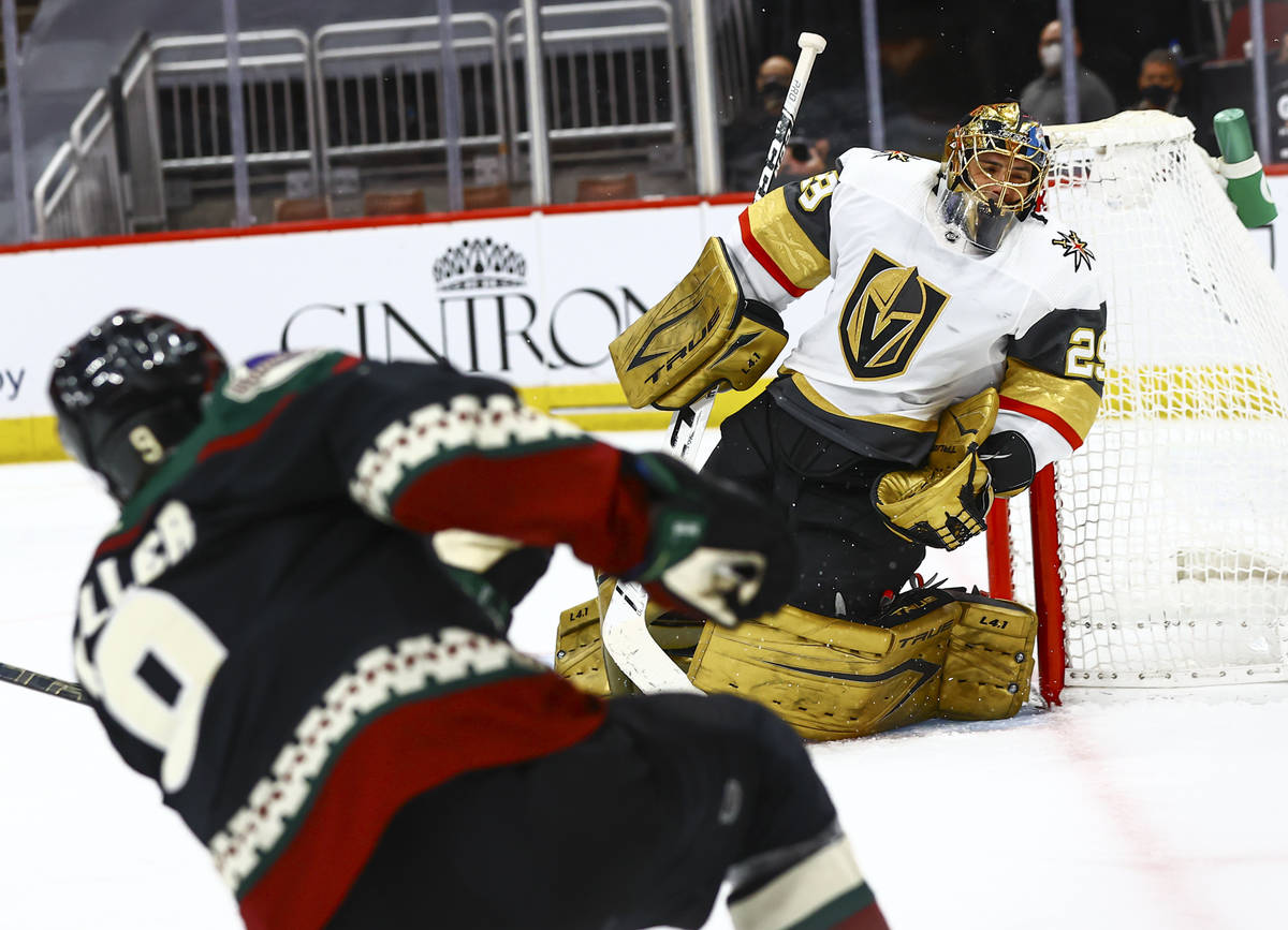 Golden Knights goaltender Marc-Andre Fleury (29) leans out of the net as Arizona Coyotes' Clayt ...