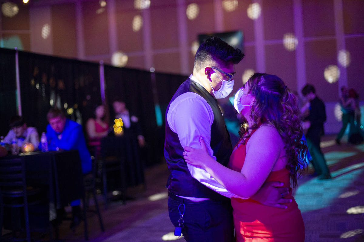Luis Vera and Melanie Juarros, both seniors at Chaparral High School, enjoy a slow dance during ...