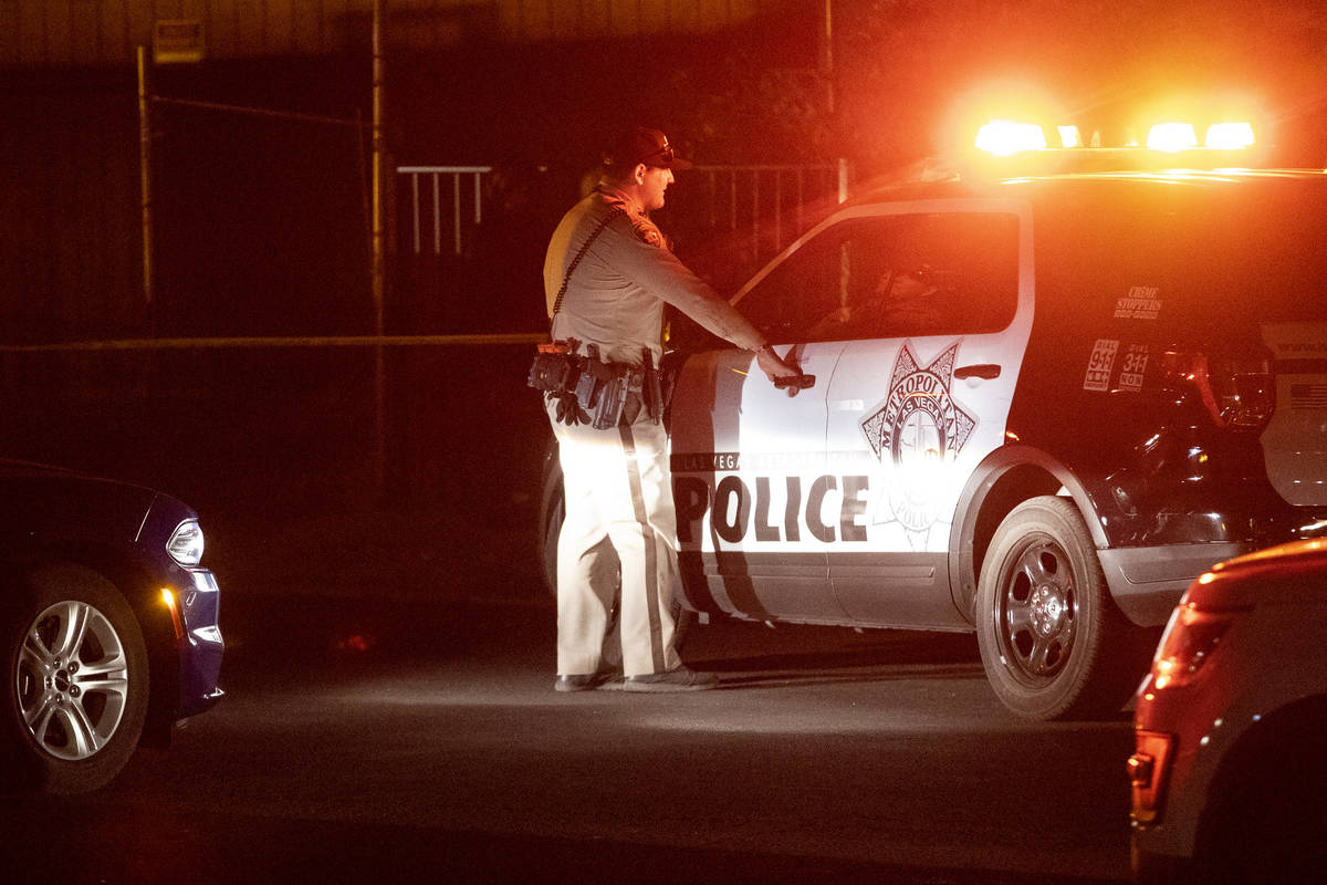 Las Vegas police investigate a body found in the 600 block of N. 10th Street, in Las Vegas, Sat ...