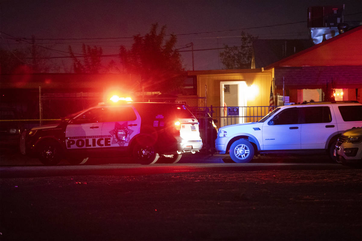 Las Vegas police investigate a body found in the 600 block of N. 10th Street, in Las Vegas, Sat ...