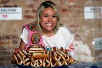 Competitive eater Miki Sudo celebrates after setting the women's world record of 48 and a half ...