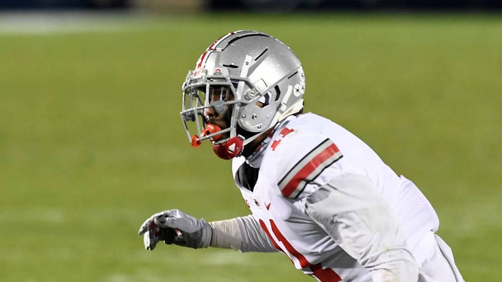 Ohio State defensive end Tyreke Smith (11) rushes the quarterback against Penn State during an ...