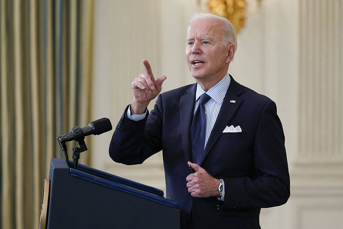 President Joe Biden takes questions from reporters as he speaks about the COVID-19 vaccination ...