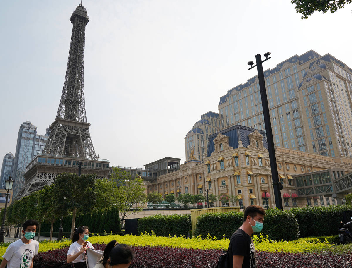 People walk along the sidewalk near the Parisian Macao on April 10, 2020. (Inside Asian Gaming)