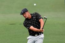 Bryson DeChambeau chips to the second hole during the third round of the Masters golf tournamen ...