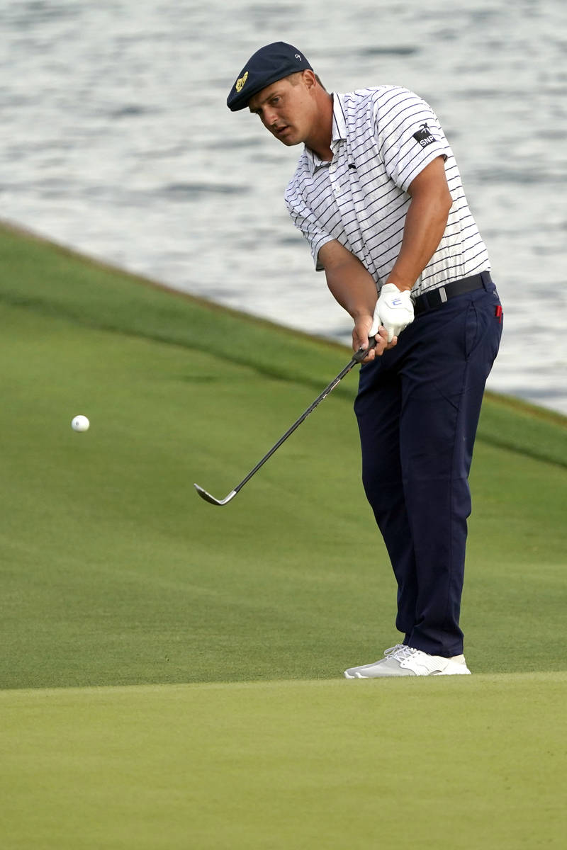 Bryson DeChambeau chips a shot during the third round at The Players Championship golf tourname ...