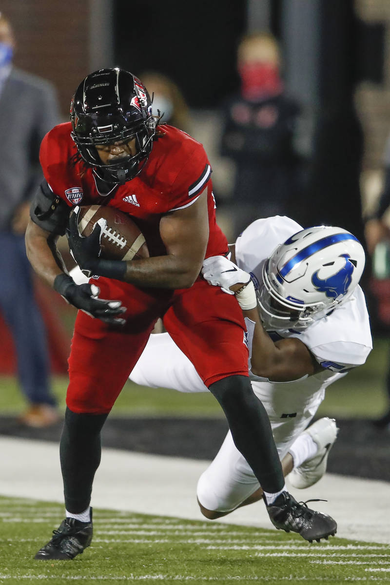 Northern Illinois Huskies tight end Daniel Crawford (88) is tackled by Buffalo Bulls defensive ...