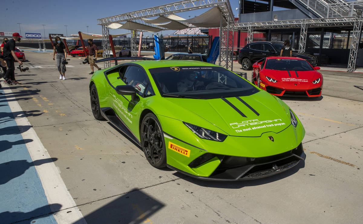 UNLV head women's basketball coach Lindy La Rocque leaves the pit area driving a Lamborghini at ...