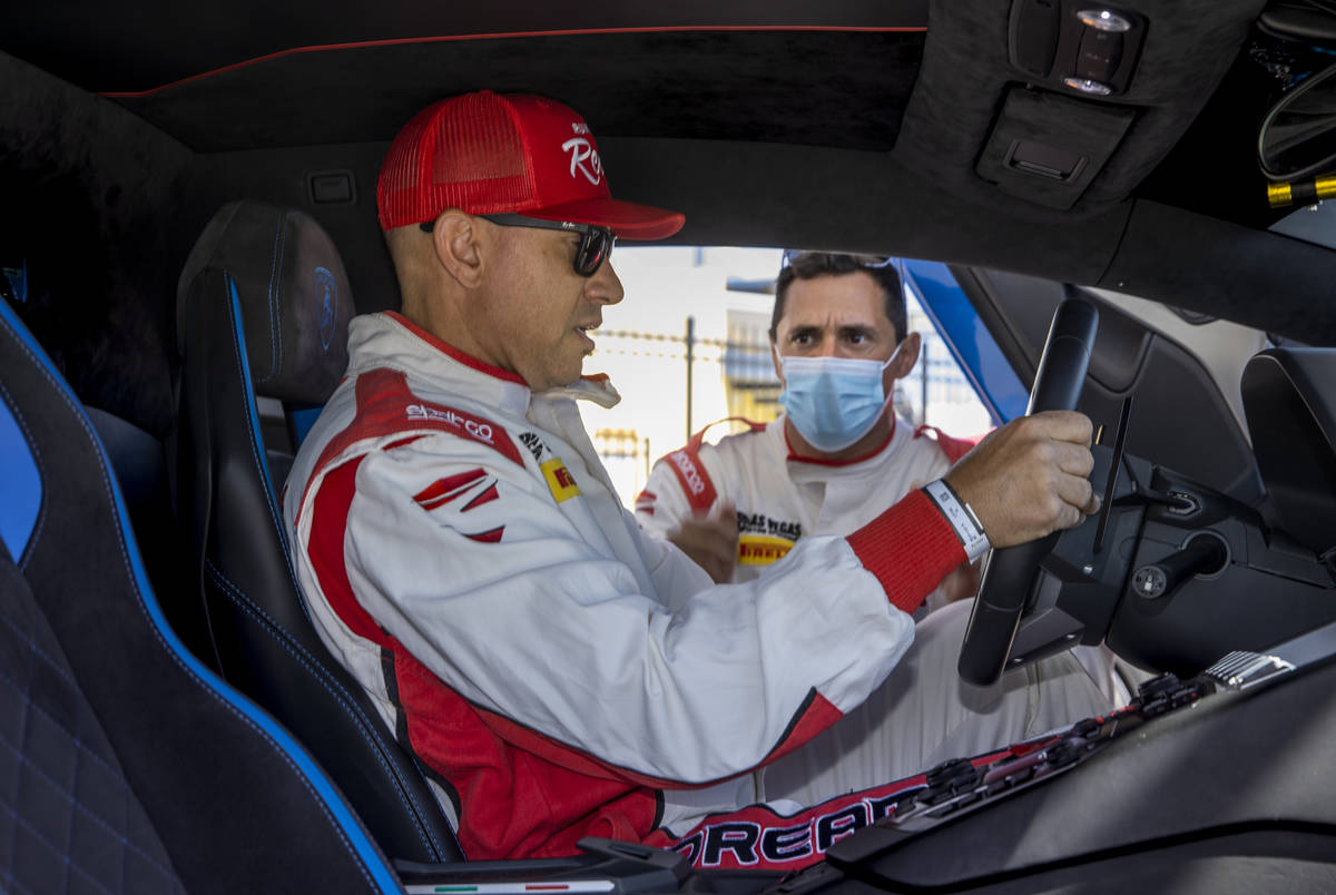 UNLV head football coach Marcus Arroyo behind the wheel with instructor Vinny Mykulak while pre ...